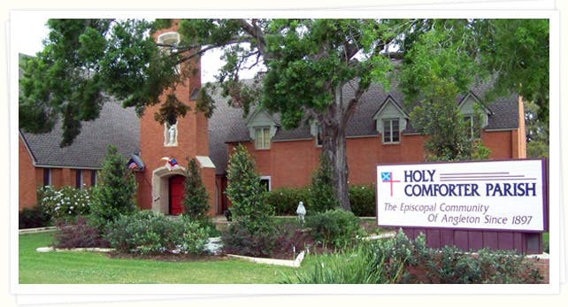 Holy Comforter Parish sign in front of a brick building