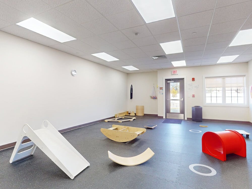 Empty classroom with small slides and tunnels for children