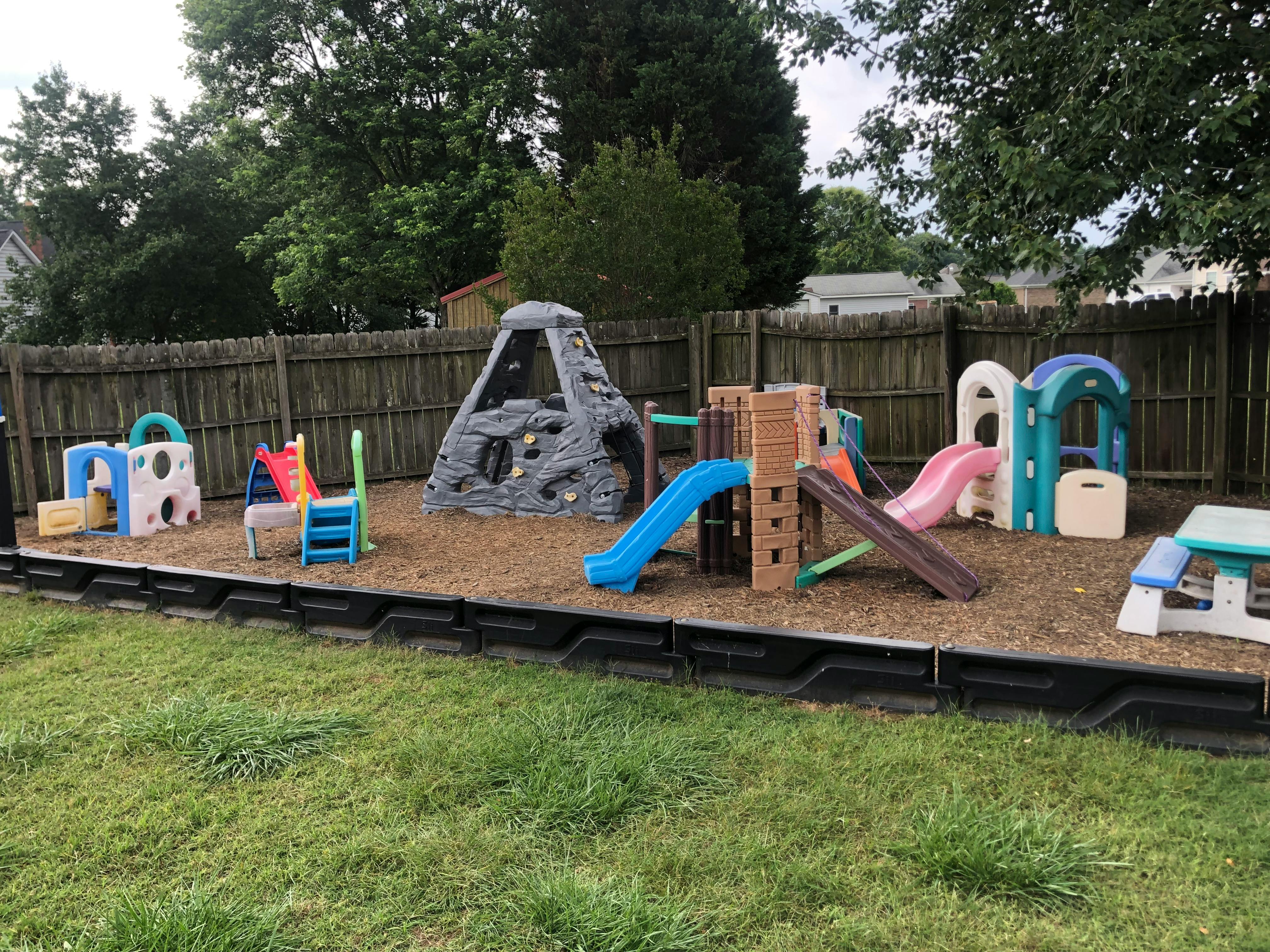Outdoor playground with multiple slides and climbing structures