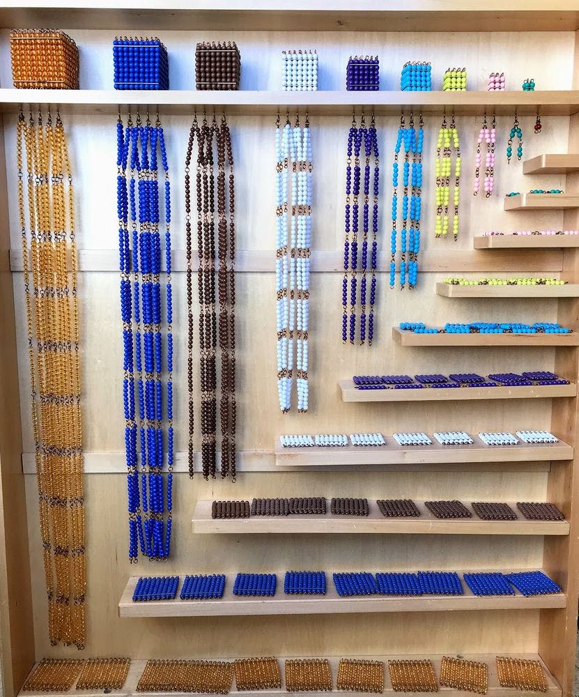 Montessori bead chains and cubes on shelves