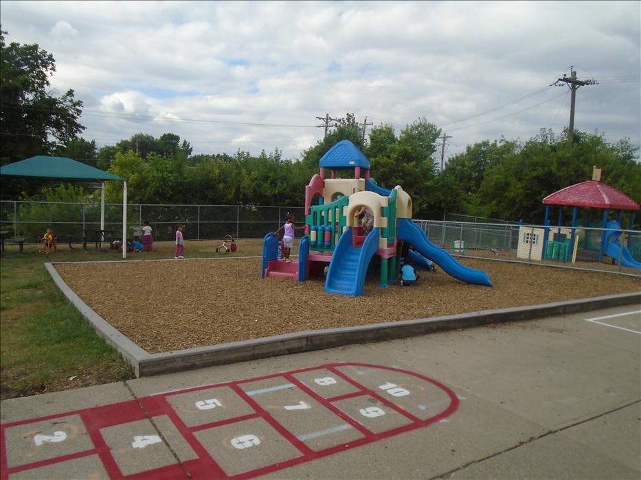 multiple children playing on playground equipment