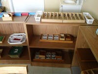 Montessori classroom shelves with learning materials