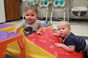 Two children playing with soft blocks