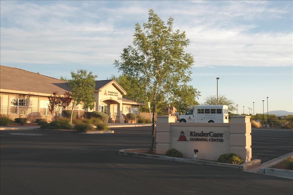 KinderCare Learning Center building and sign in front of a parking lot