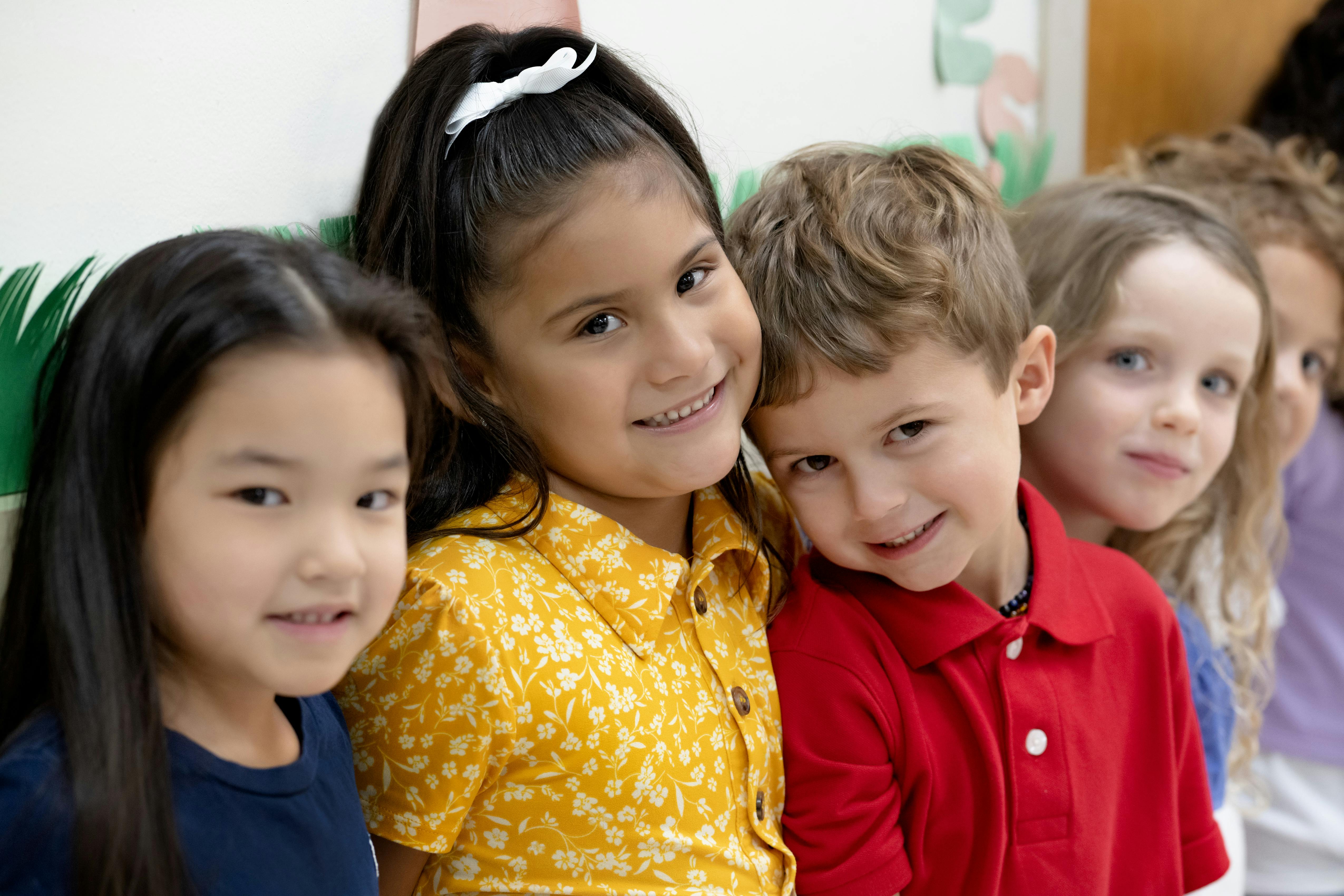 Four children standing in a line