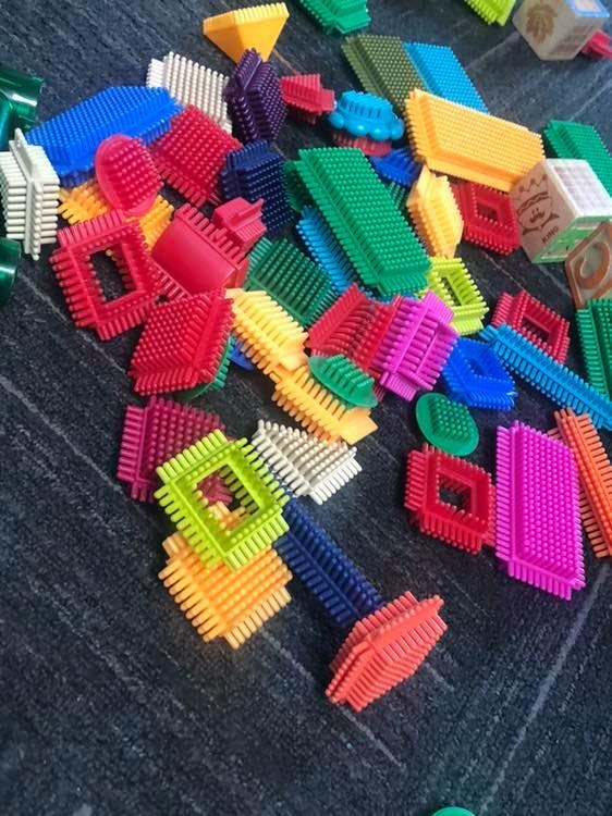 Pile of colorful interlocking plastic building blocks