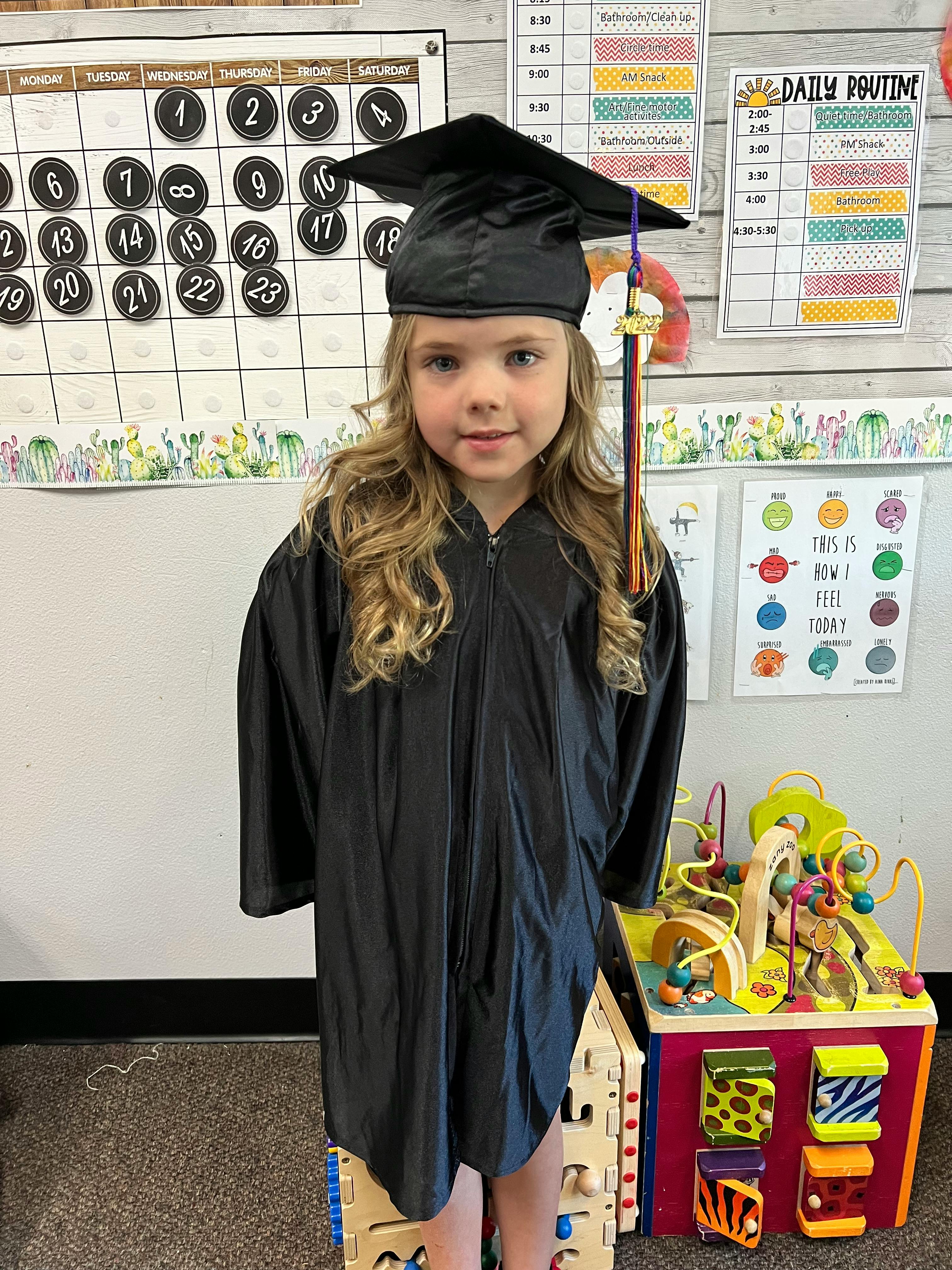 Child in a graduation cap and gown