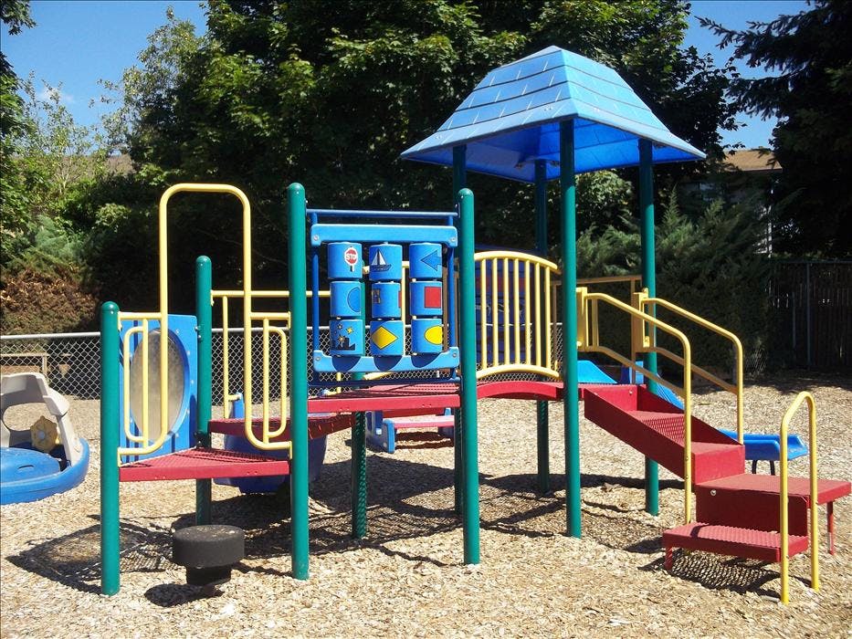 Colorful playground structure on wood chips