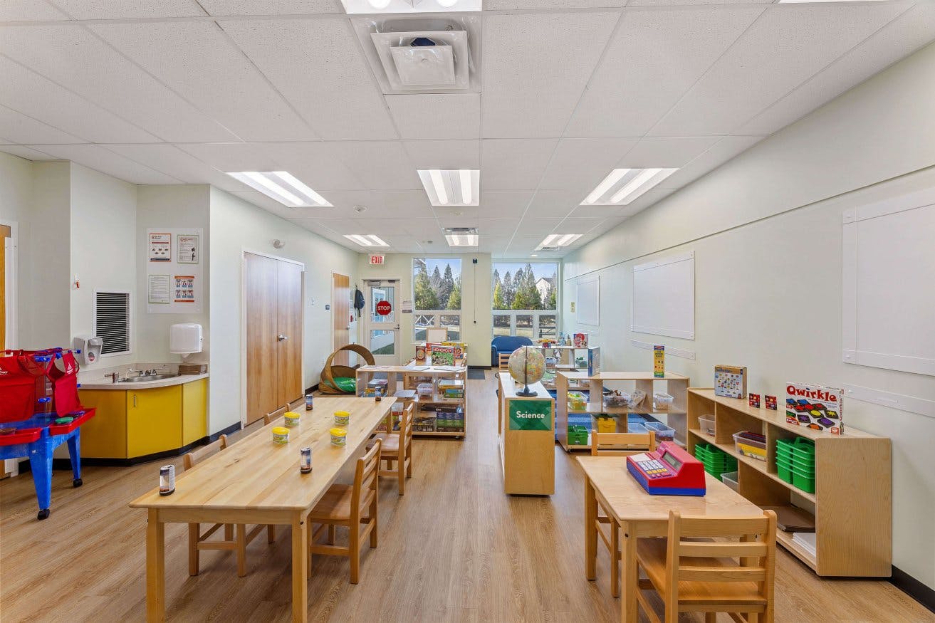 Classroom with tables, chairs, and learning materials