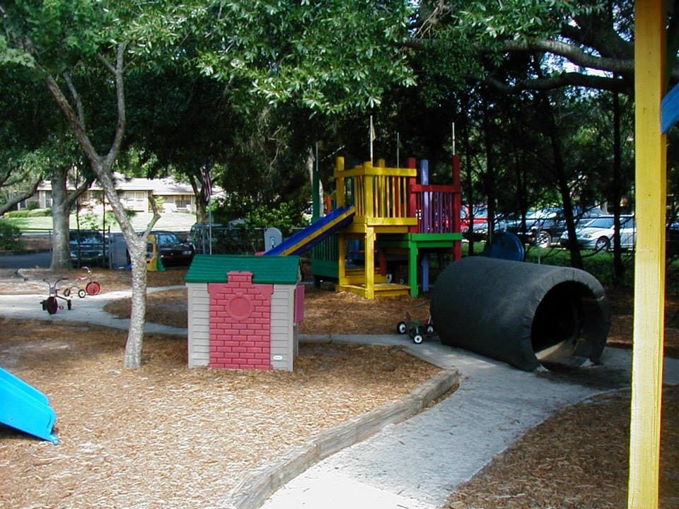 Playground with slides, playhouse, and tunnel