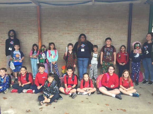 Group of adults and children posing for a photo
