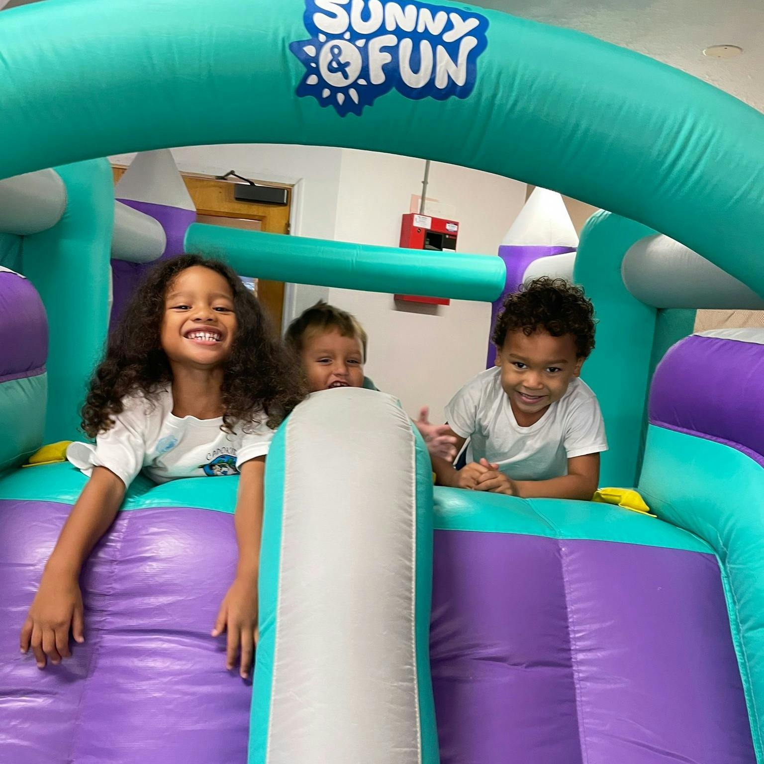 Children playing in an inflatable bounce house