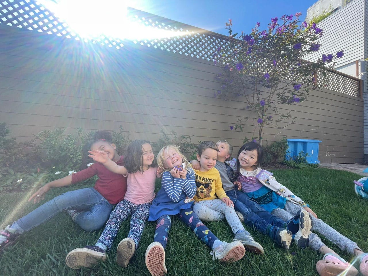 Group of children sitting on grass