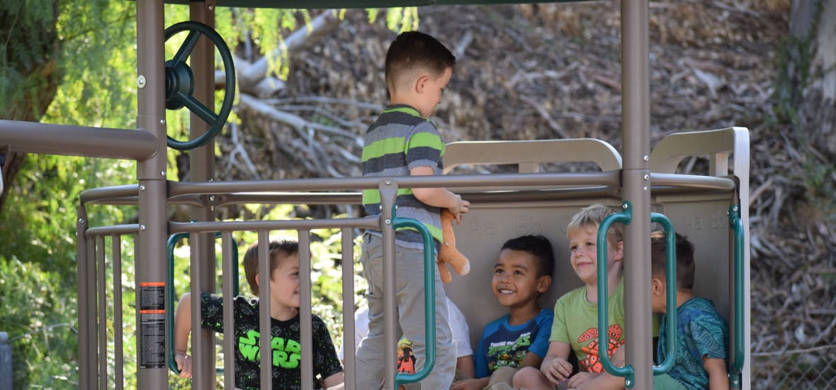 Children playing on playground equipment