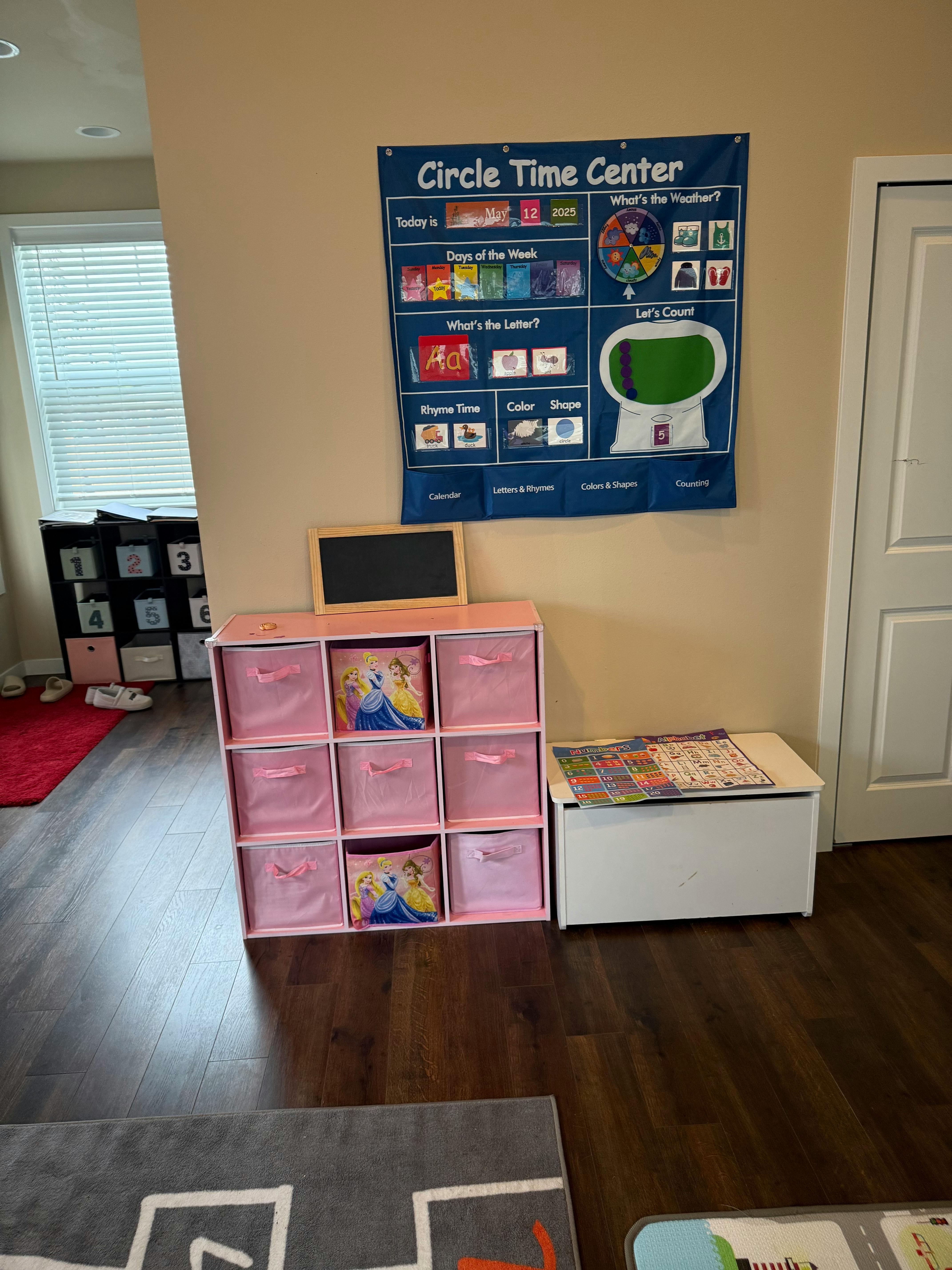 Circle Time Center banner on a wall above a pink storage unit with bins