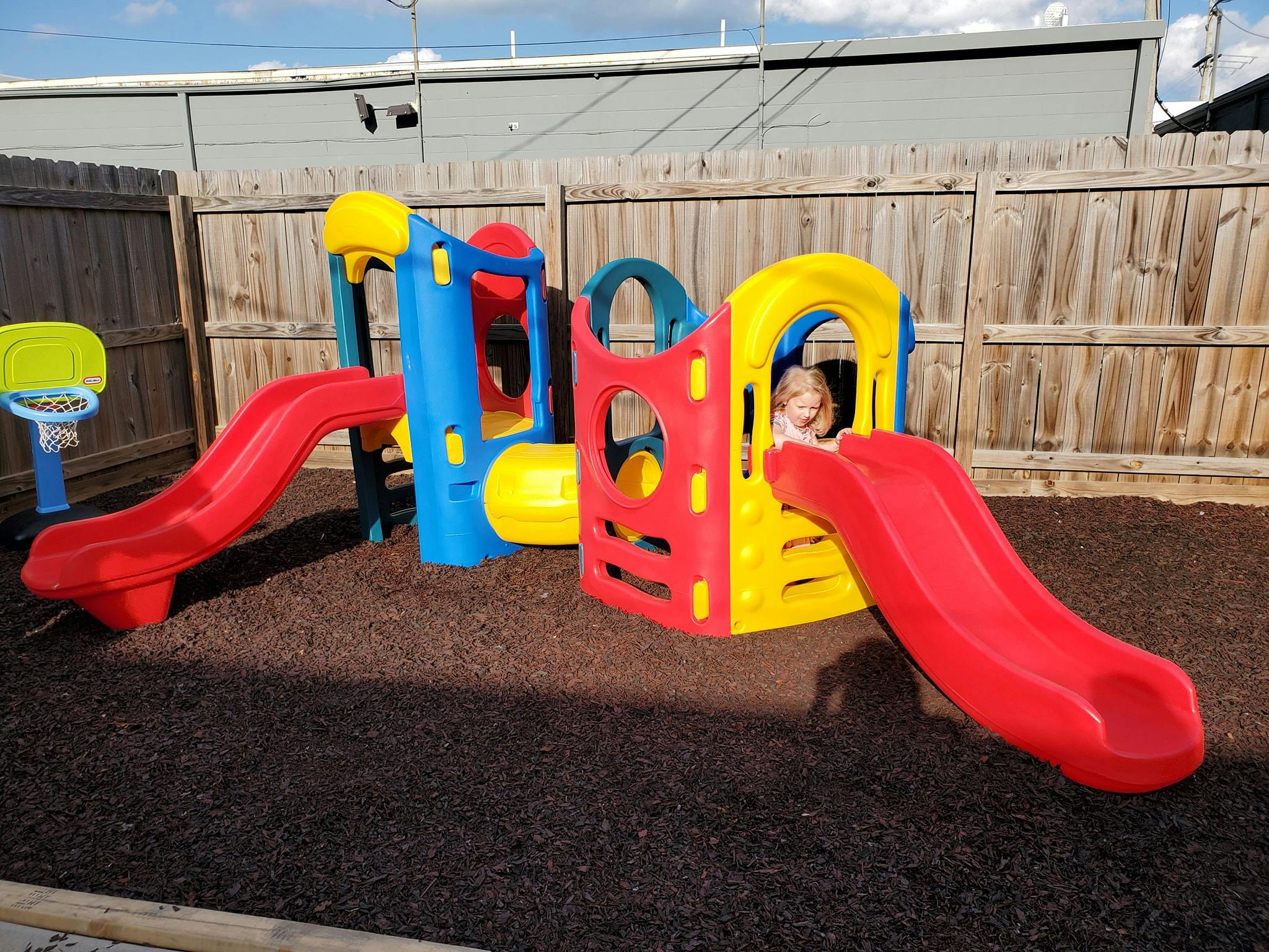 Child on a colorful playground slide