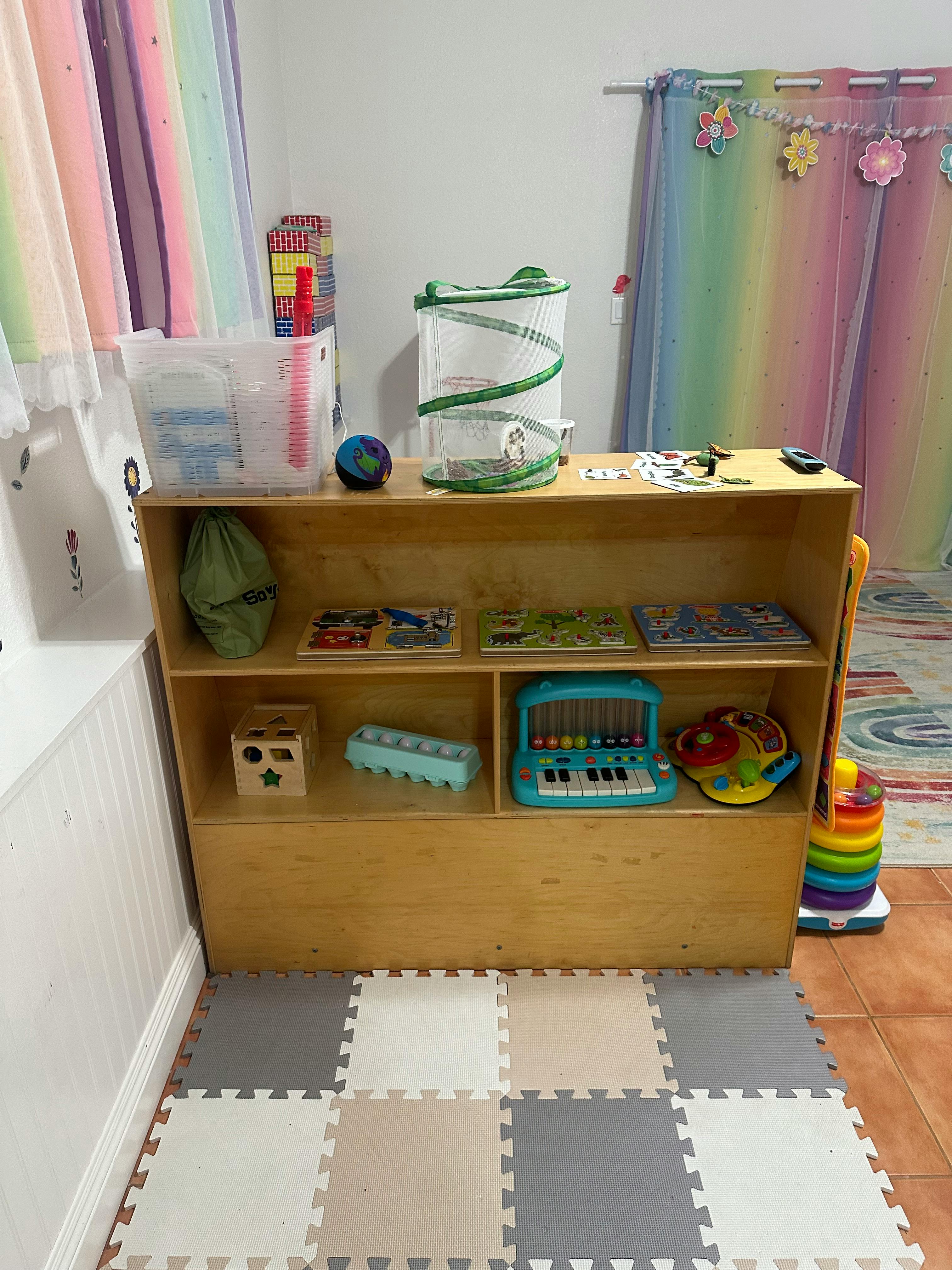 Wooden shelf with various toys and learning materials