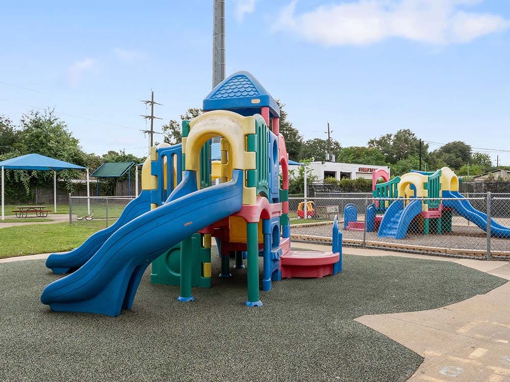 Colorful playground with slides and climbing structures