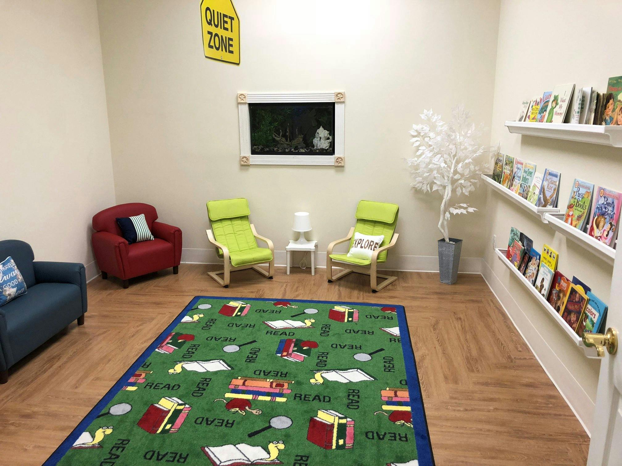 Quiet zone with chairs, rug, and bookshelves