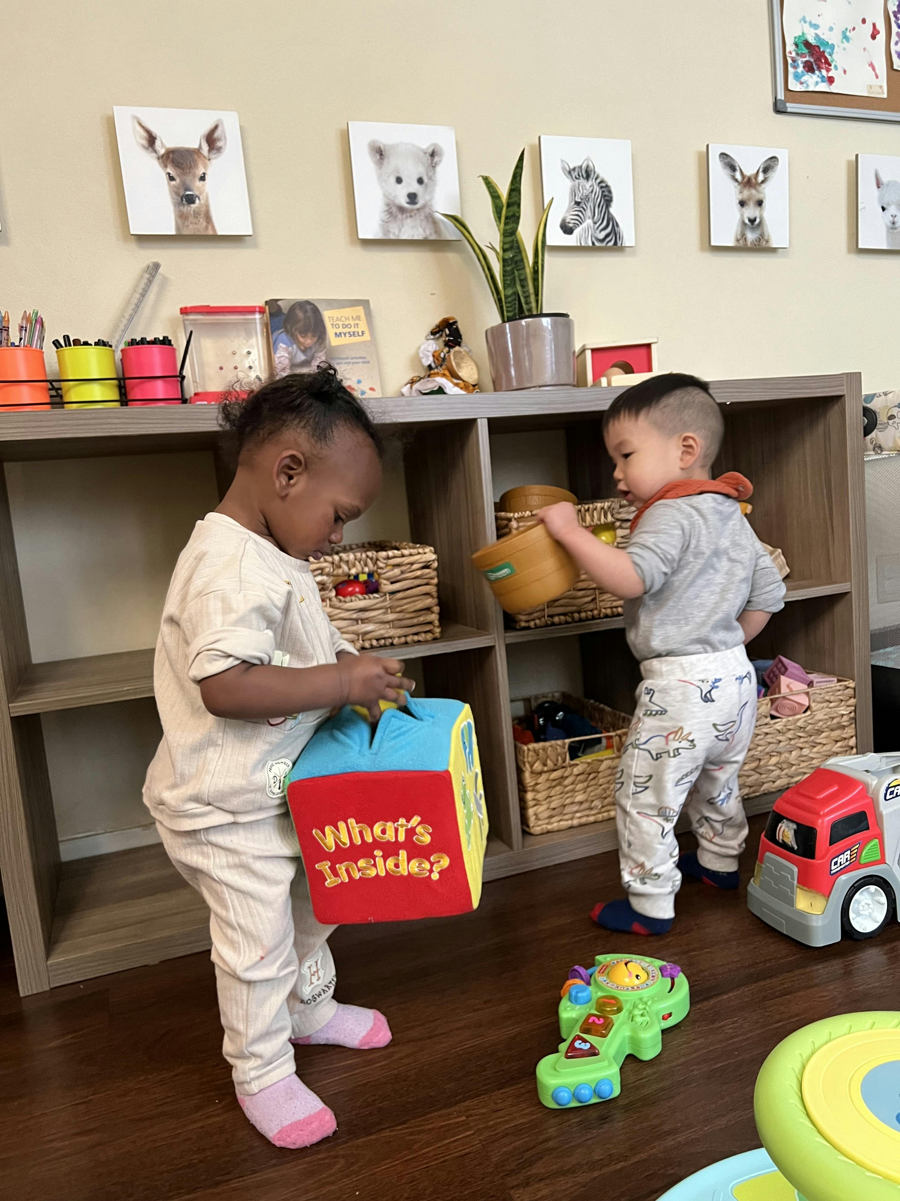 Two children playing with toys in a room