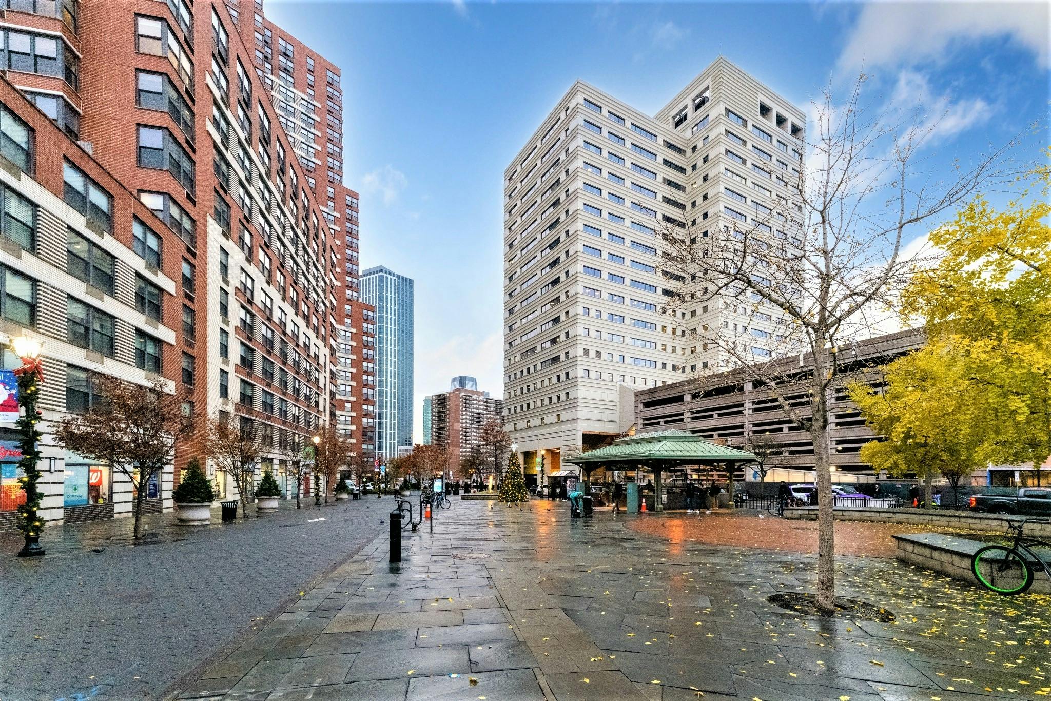 City street with tall buildings and people walking