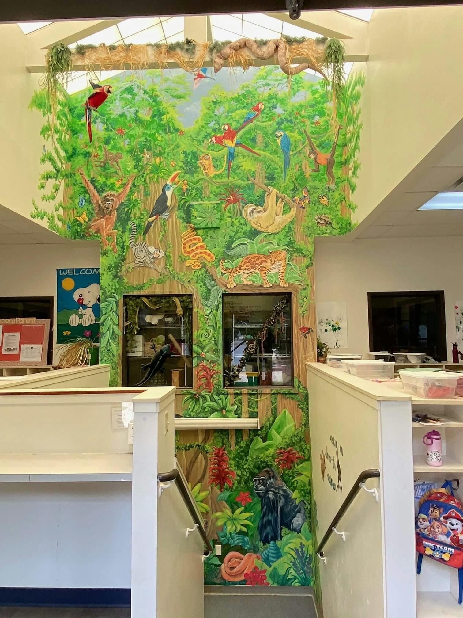 Colorful mural of jungle animals on a tall wall
