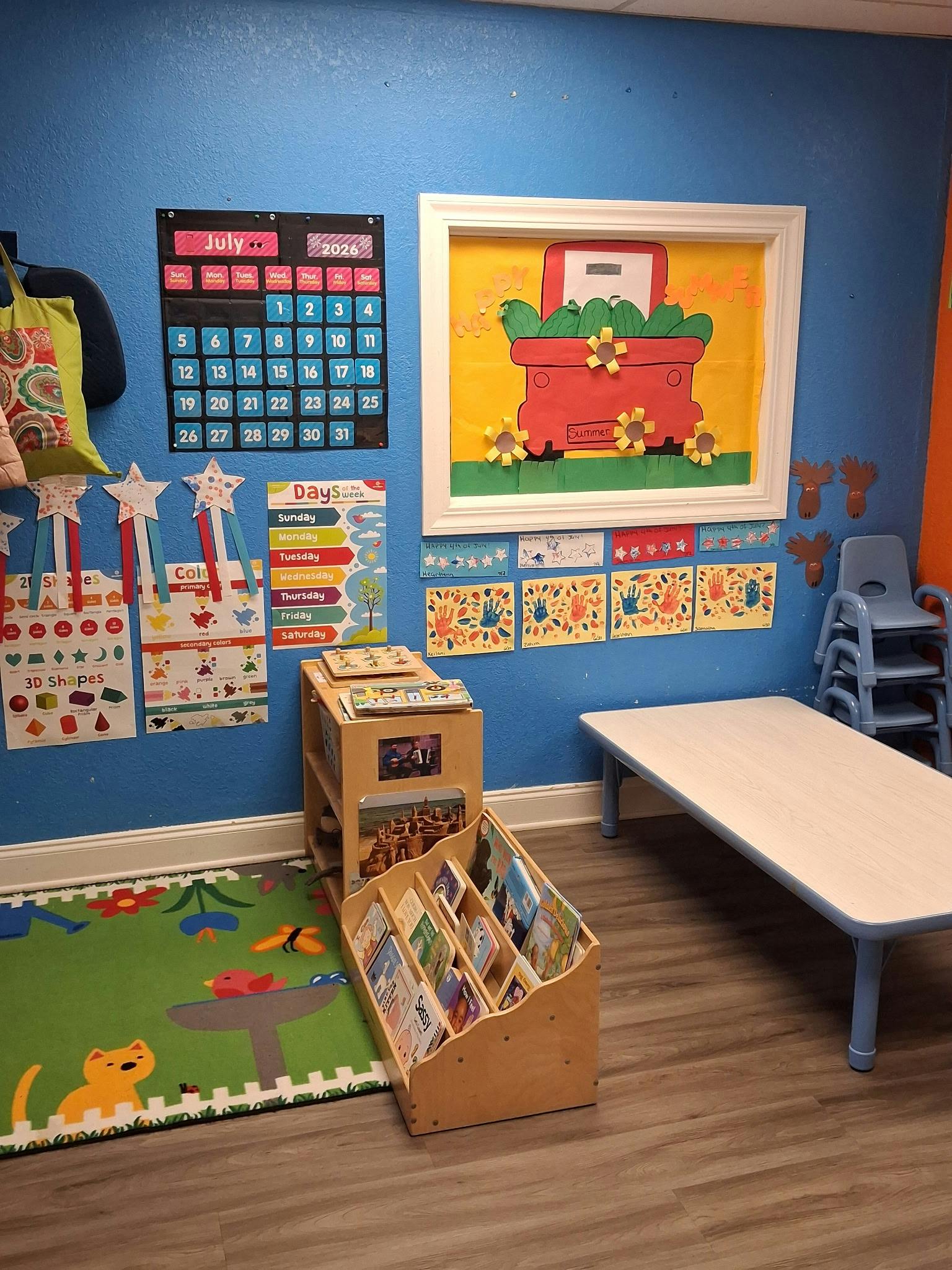 Classroom wall decorated with educational posters and seasonal student artwork