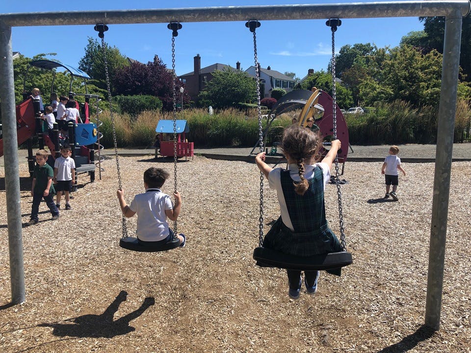 Children on swings at a playground