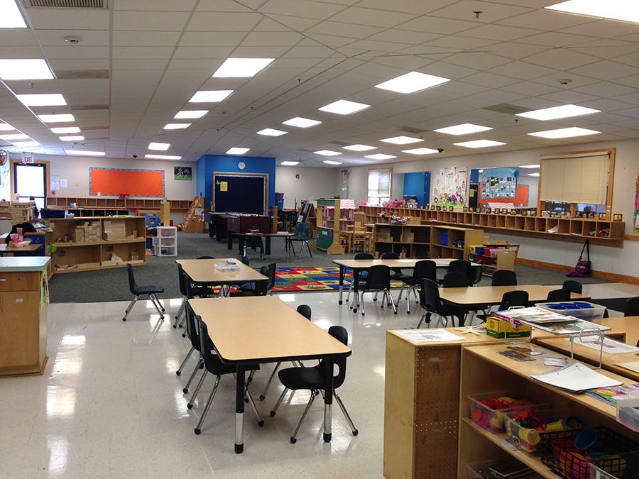 Empty classroom with tables and chairs