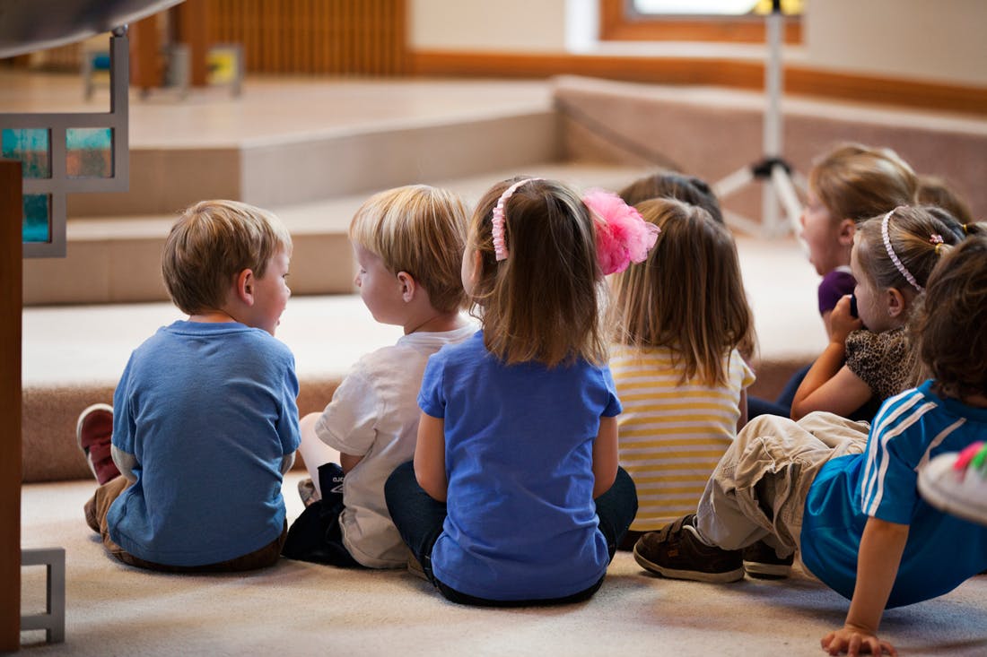 Group of children sitting on the floor