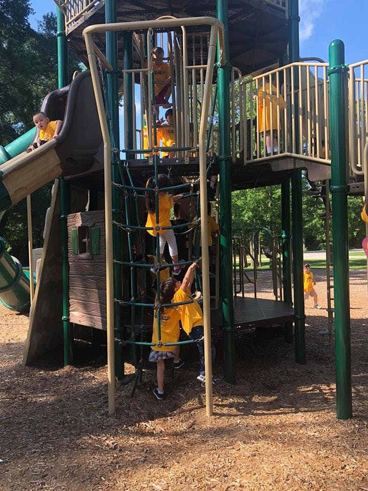 Children playing on a playground structure