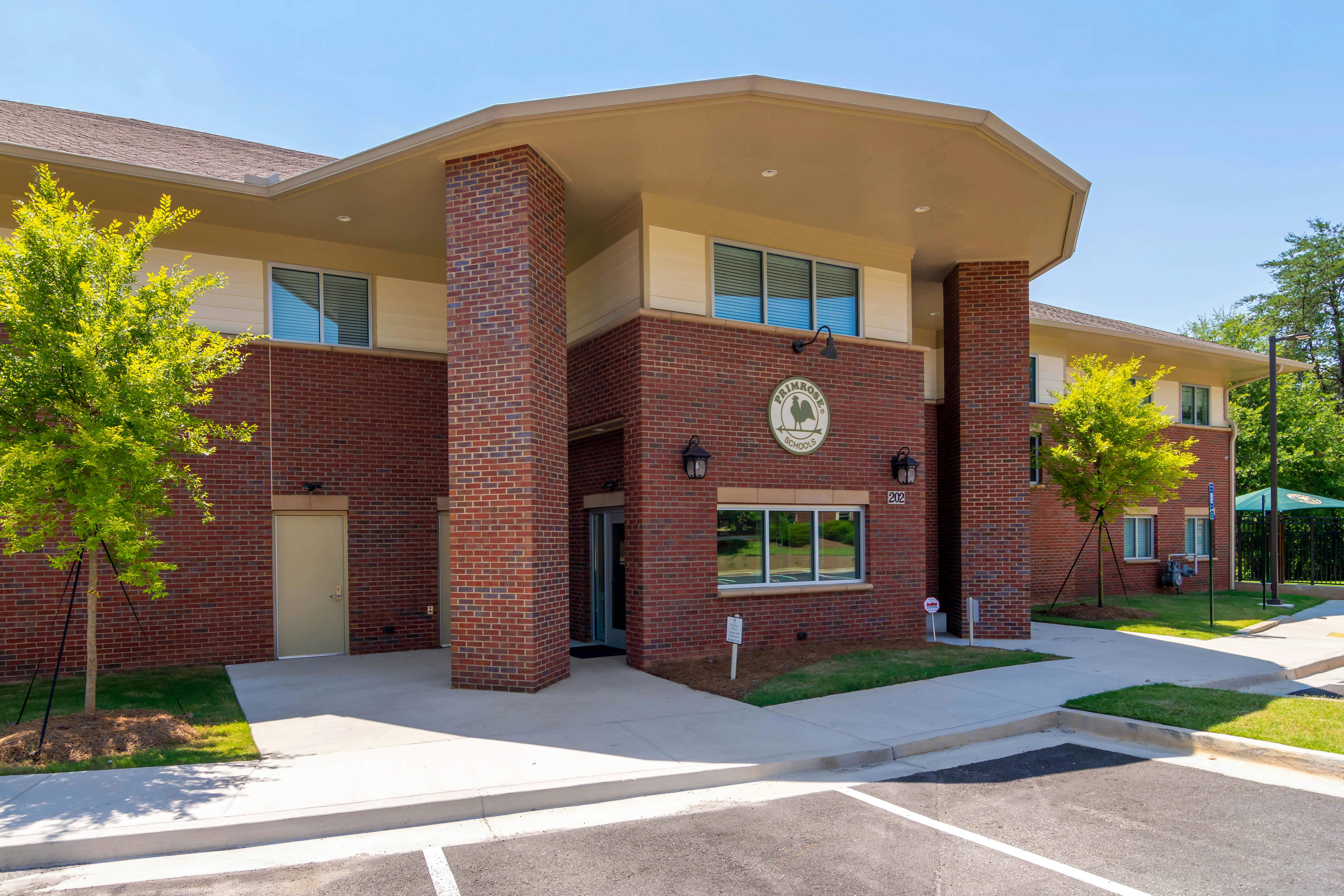 Brick building with a sign that says Primrose Schools