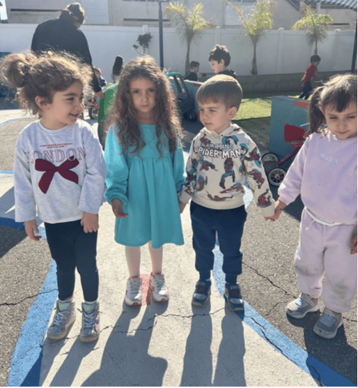 Four children standing outdoors