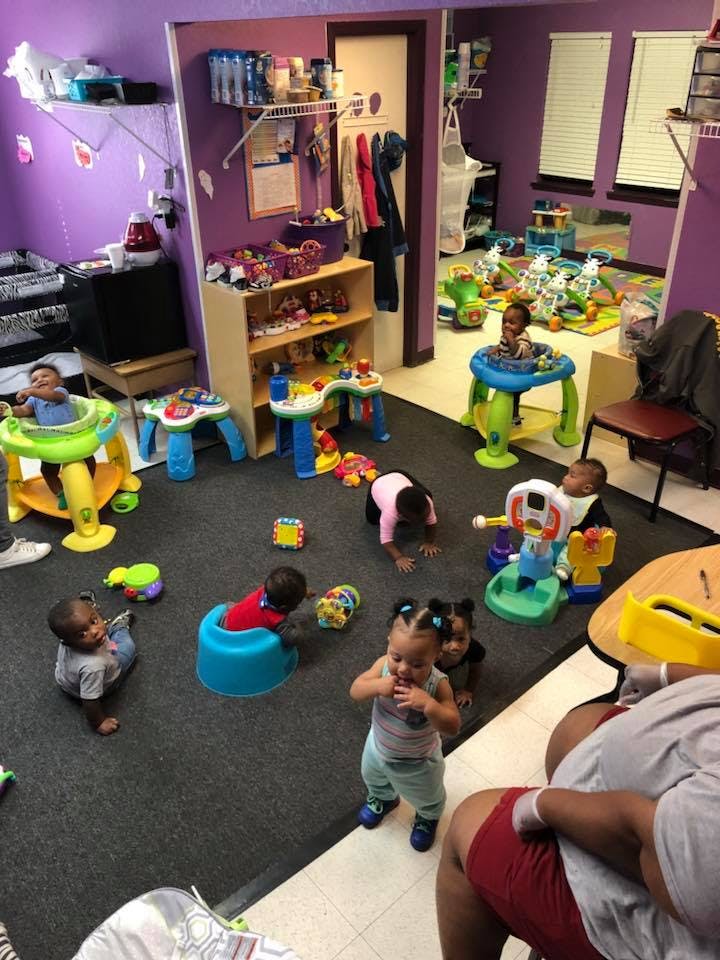 Multiple children playing with toys in a room