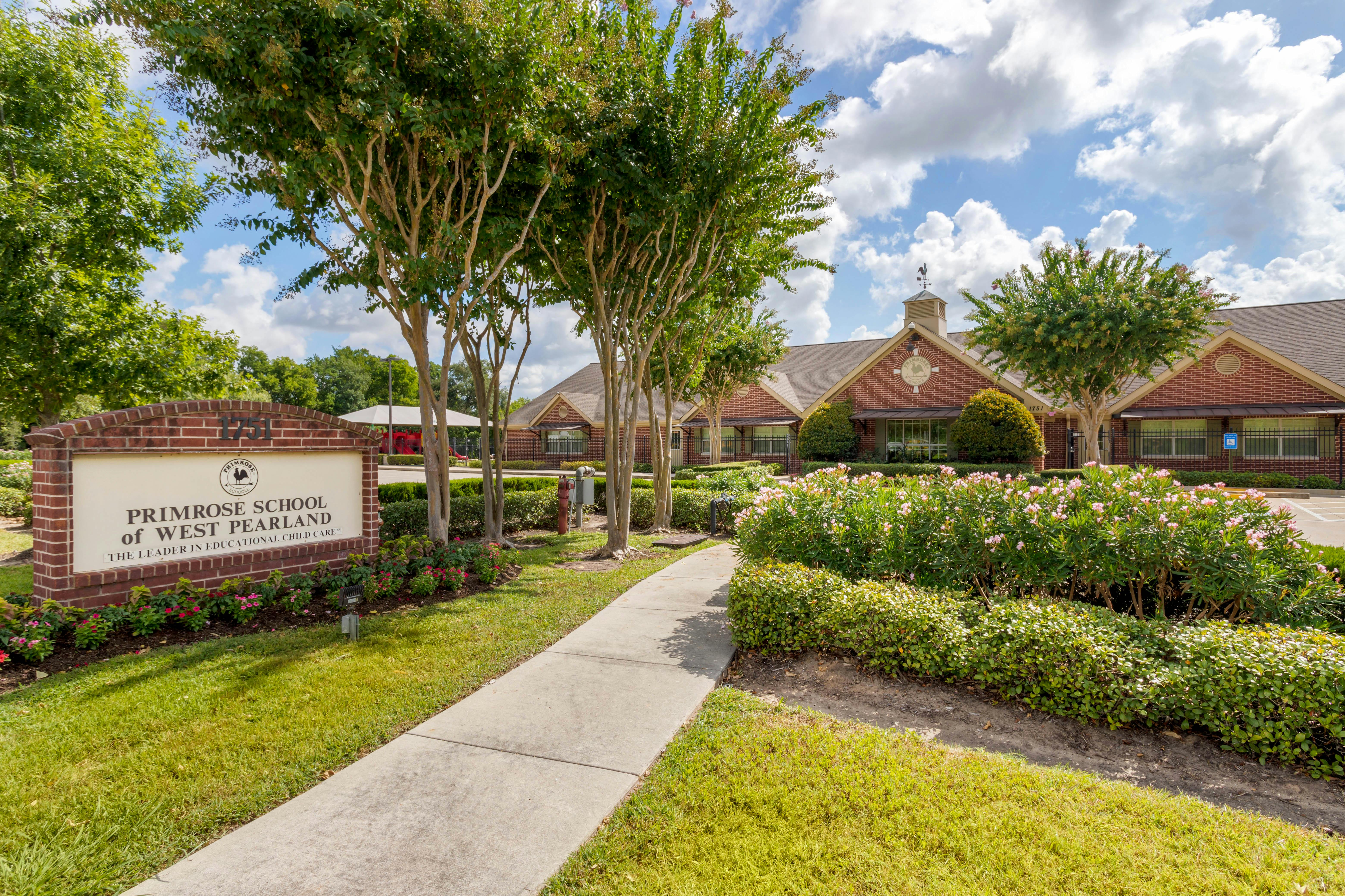 Sign for Primrose School of West Pearland in front of a building