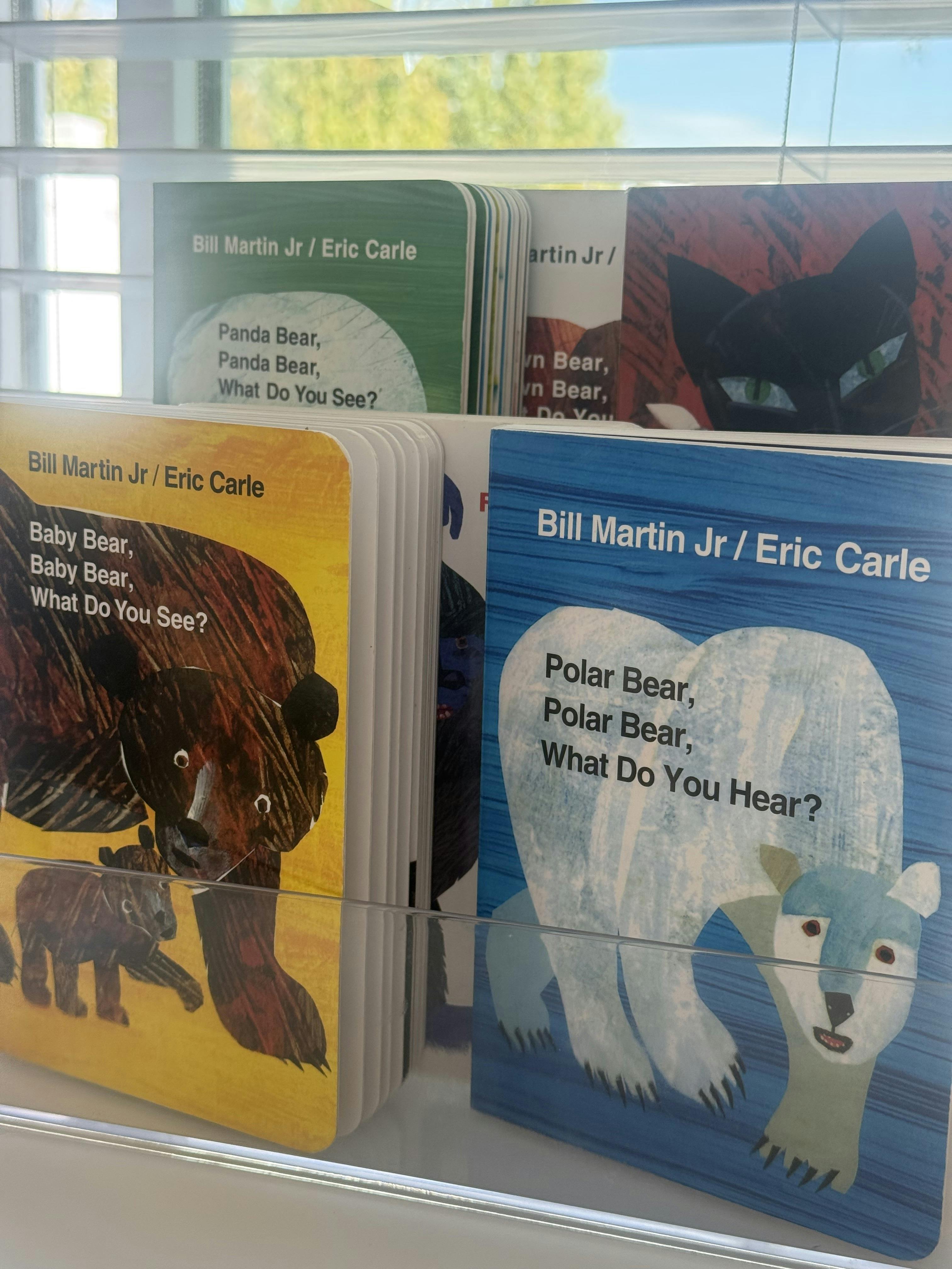 Several children's books by Bill Martin Jr and Eric Carle on a display shelf