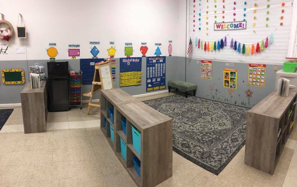 Classroom with colorful decorations and a rug