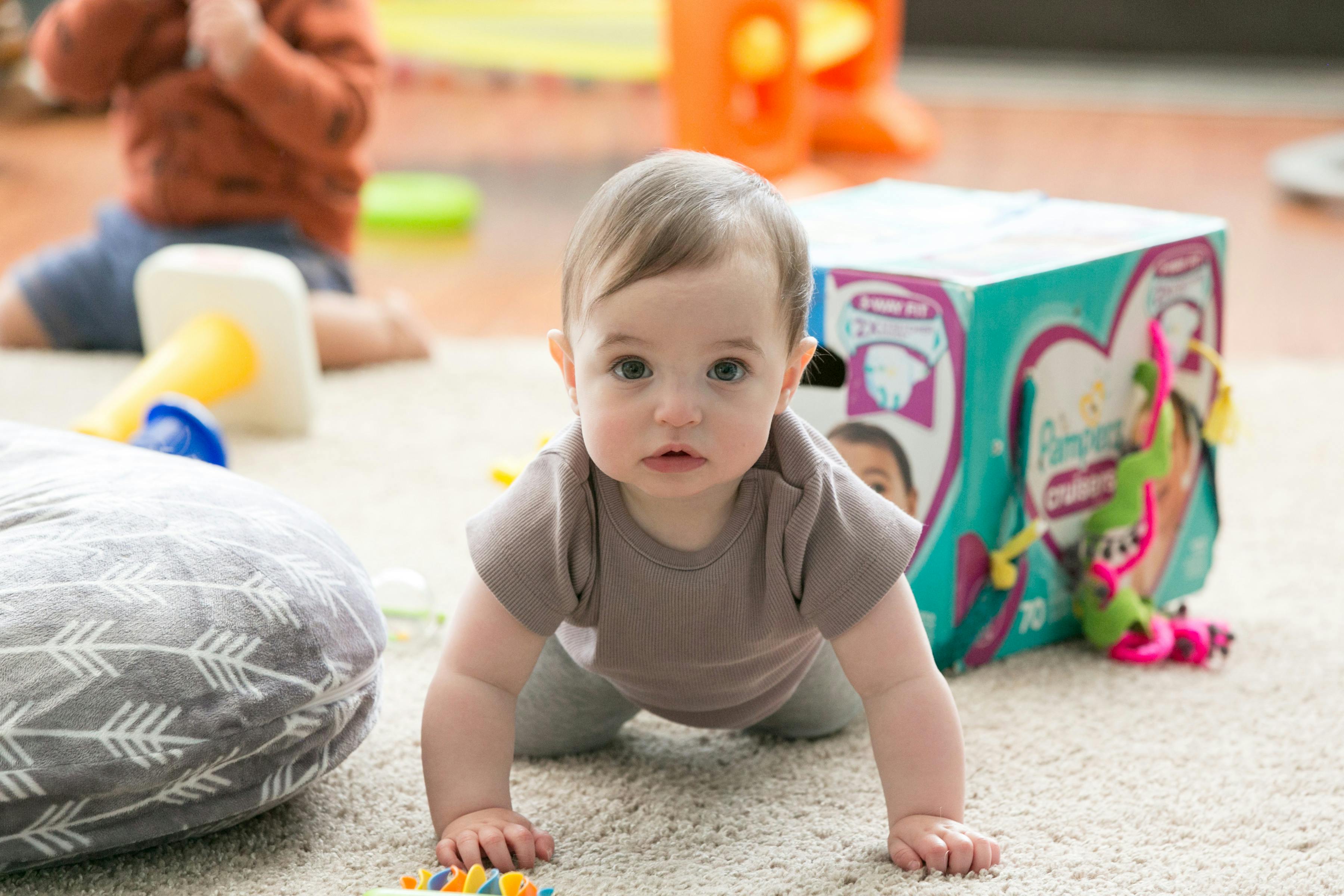 Child crawling on a carpeted floor