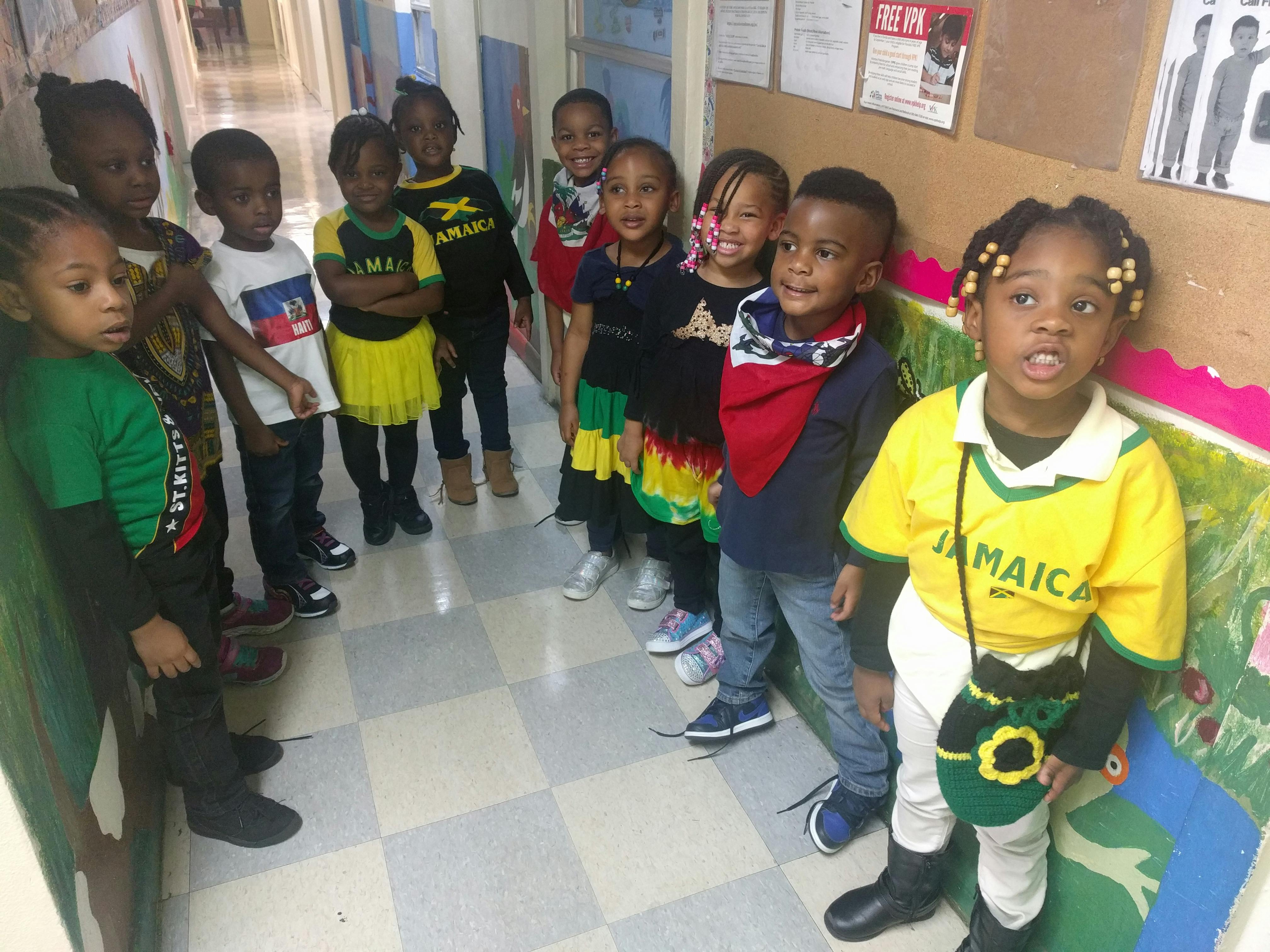 Group of children standing in a hallway