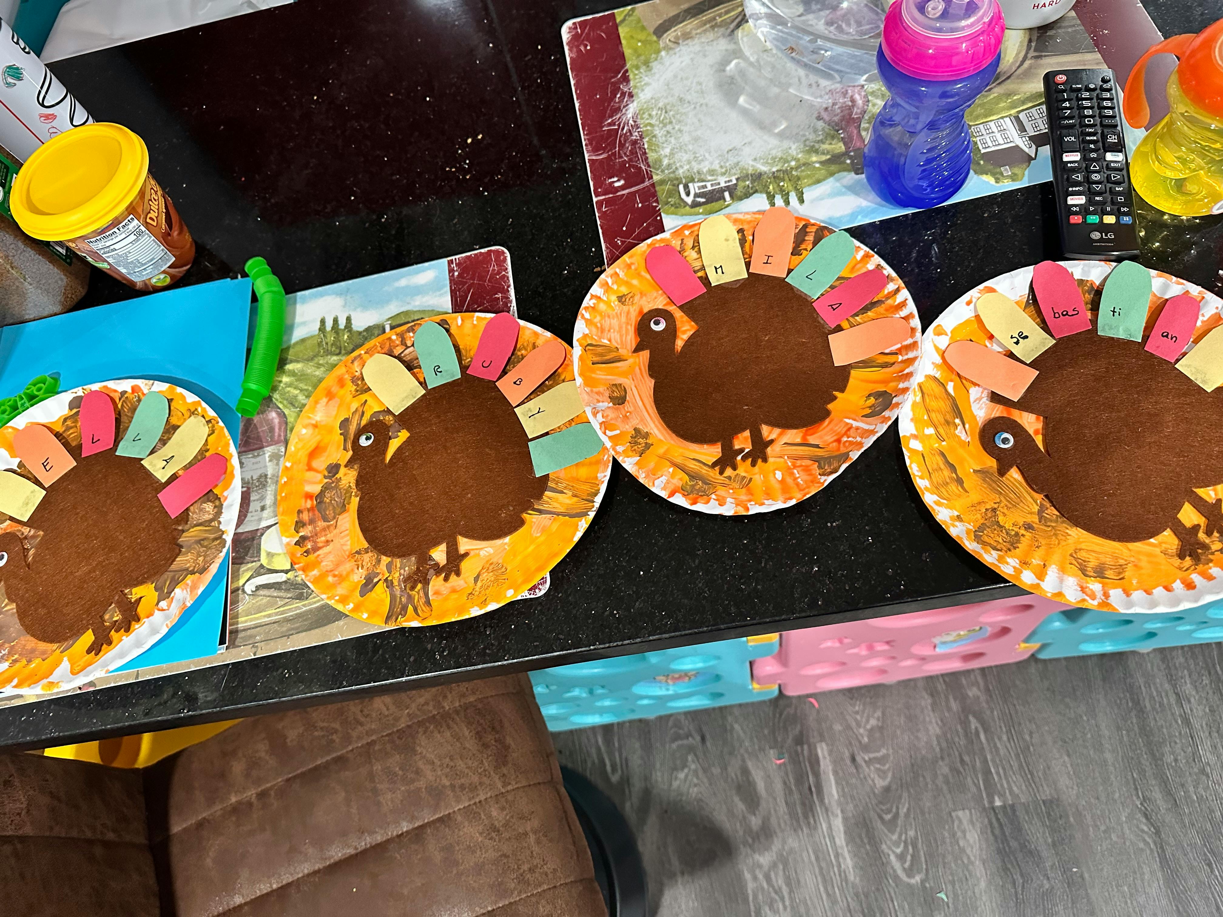 Three turkey crafts made from paper plates and construction paper