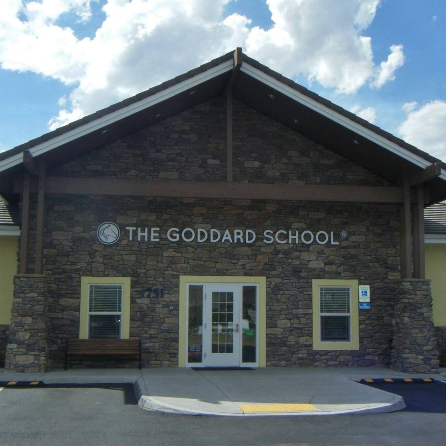 Building with "THE GODDARD SCHOOL" sign above the entrance