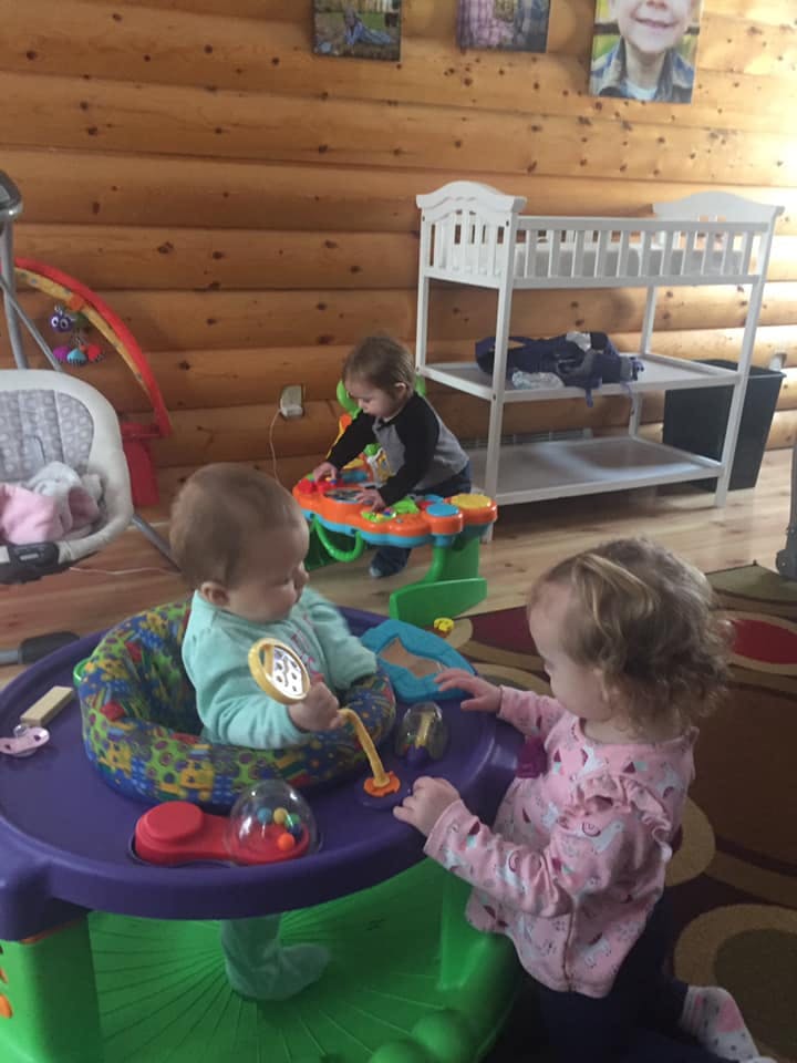Three children playing with toys