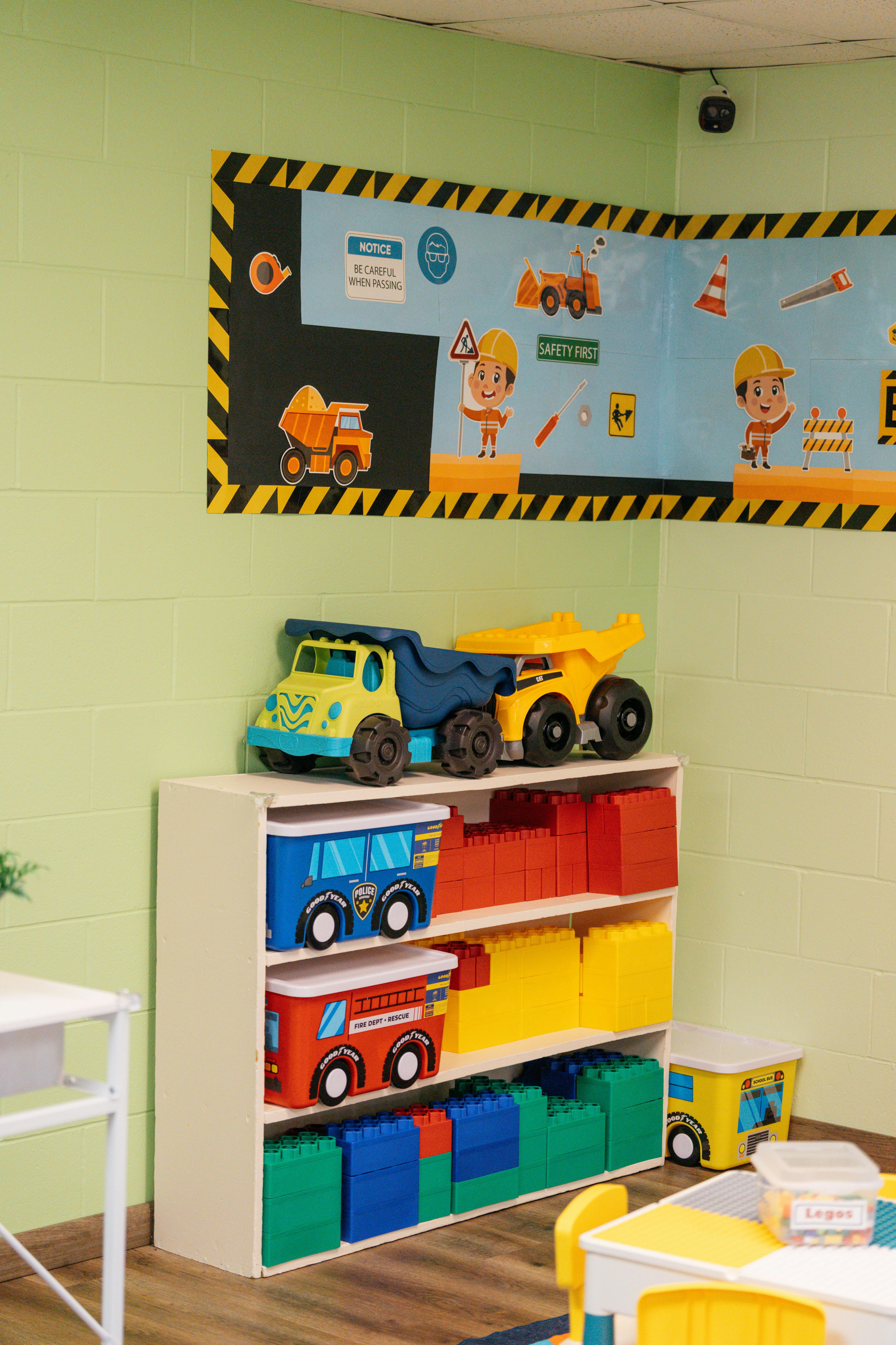 Toy dump truck and construction-themed decor in a classroom
