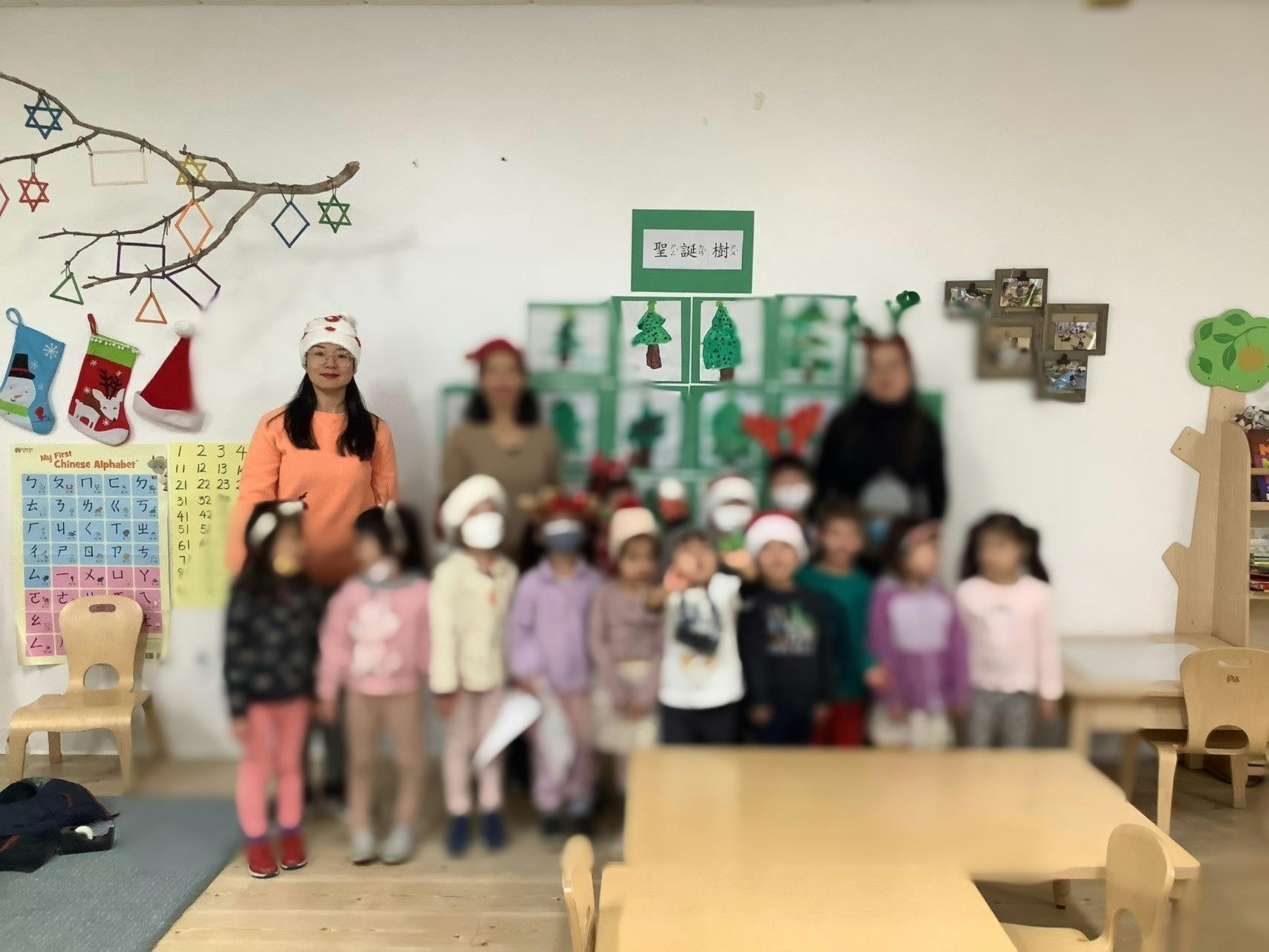 Adults and children in a classroom