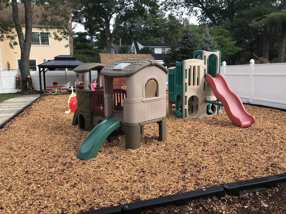 Playground with play structure and slides on wood chips