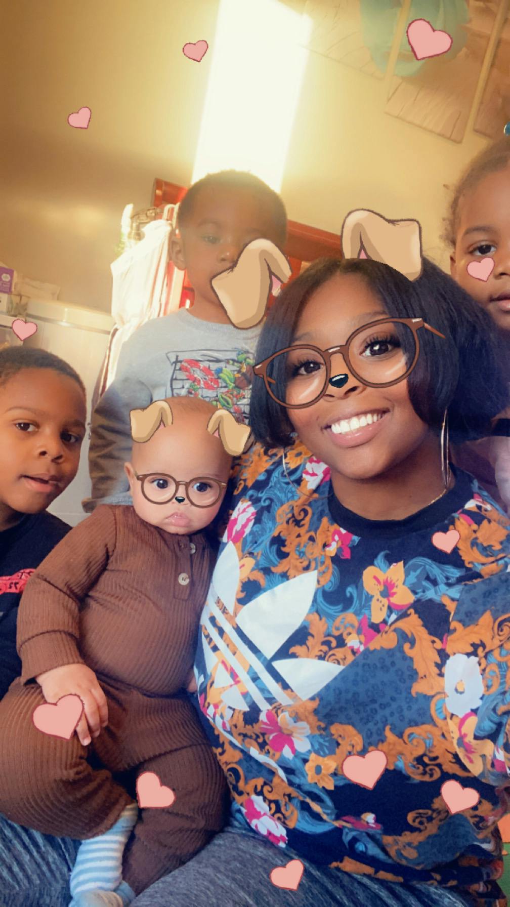 Person with three children, all with filter effects