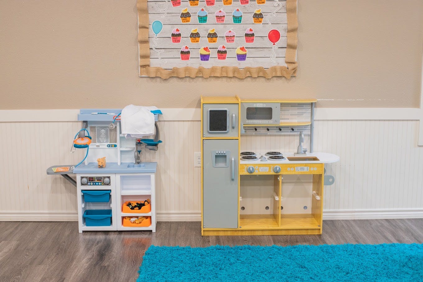 Toy kitchen and medical playsets in a room