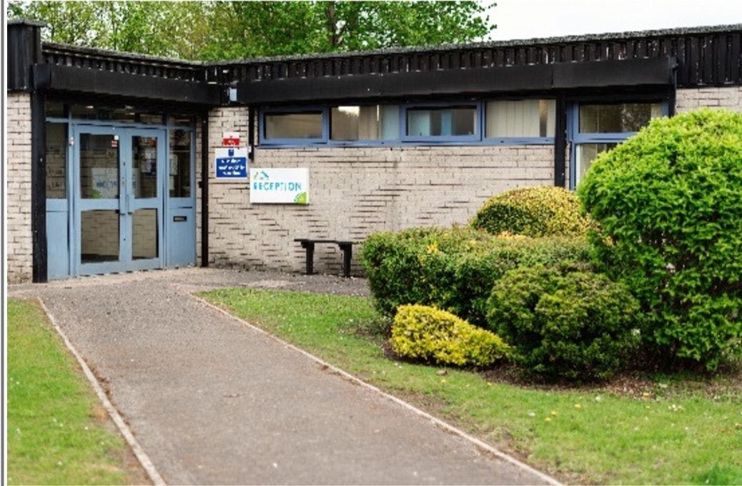 Entrance to a building with a 'Reception' sign