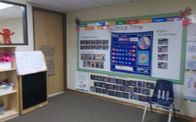 Classroom wall with a "Group Time" display, calendar, and student work