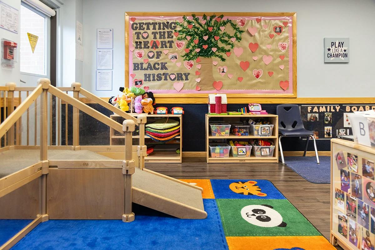Classroom with toy storage and a bulletin board about Black History Month